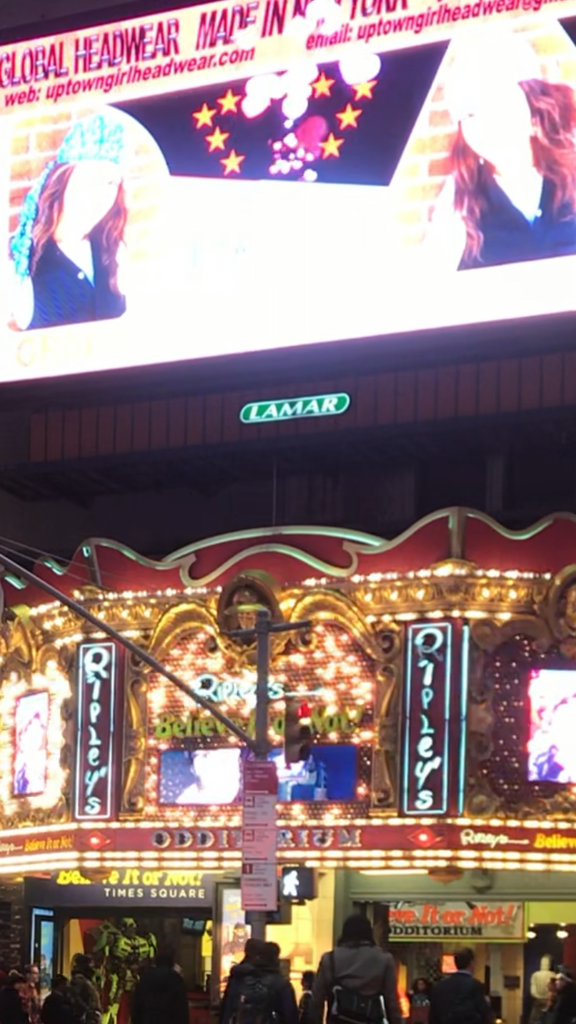 Uptown Girl Headwear ads in Times Square